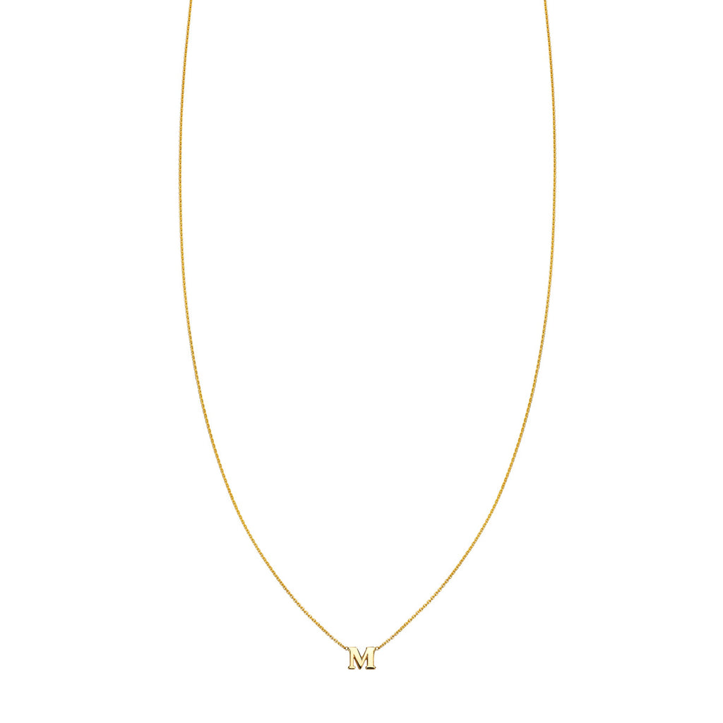 Discover unique style with the gold necklace showcasing the letter 'M' by Phoenix Roze. Handcrafted for personalized elegance, it adds a touch of sophistication to any look.