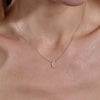 gold diamond moon necklace on neck